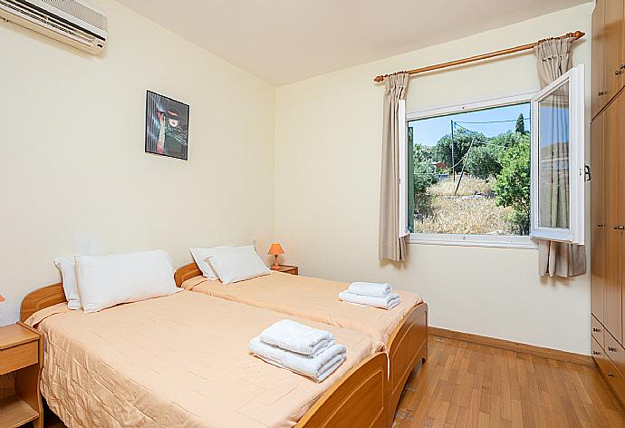 Twin bedroom with A/C . - Villa Vasso . (Photo Gallery) }}