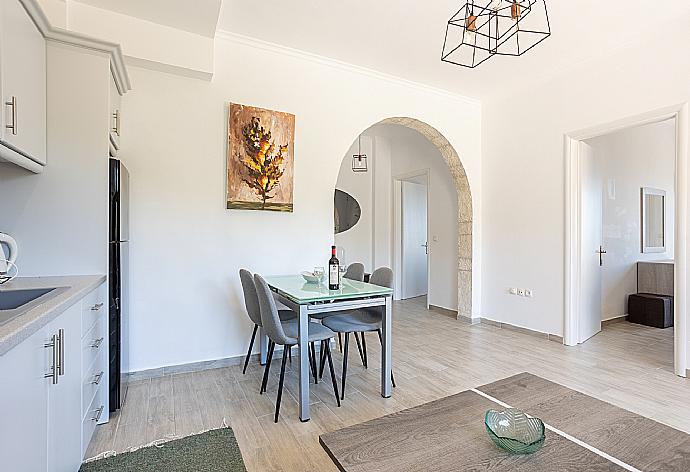 Open-plan living room with sofa, dining area, kitchen, WiFi internet, and terrace access . - Villa Vasso . (Galería de imágenes) }}