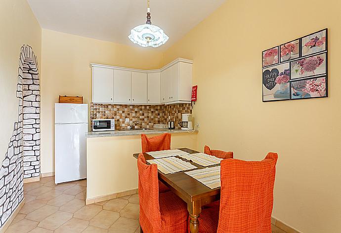 Living area with dining area, kitchen, TV, and terrace access . - Villa Thespina . (Galleria fotografica) }}