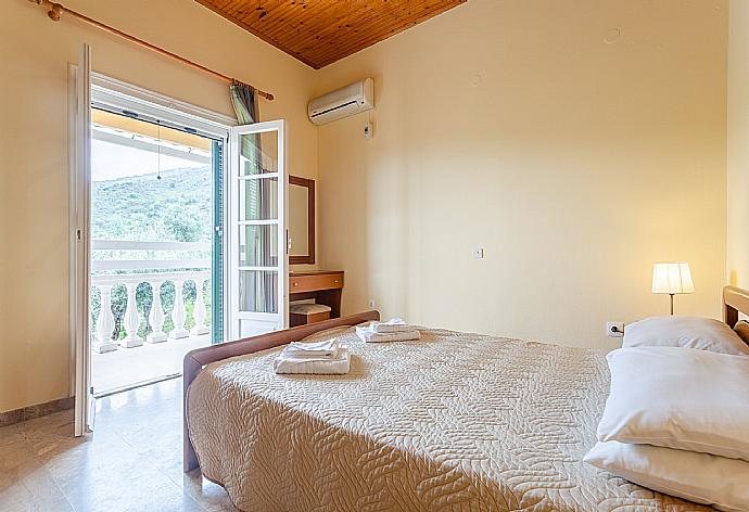 Double bedroom with A/C and balcony access . - Villa Thespina . (Photo Gallery) }}