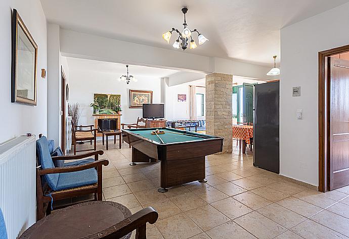 Second living room with sofas, dining area, kitchen, pool table, table football, ornamental fireplace, WiFi internet, satellite TV, and terrace access . - Villa Zeus . (Fotogalerie) }}