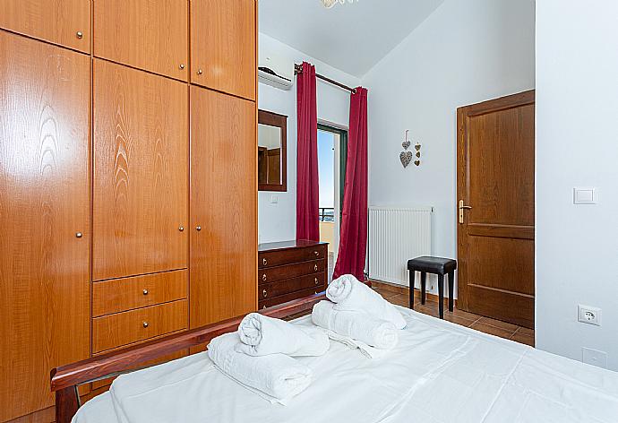 Double bedroom with A/C and balcony access . - Villa Zeus . (Photo Gallery) }}