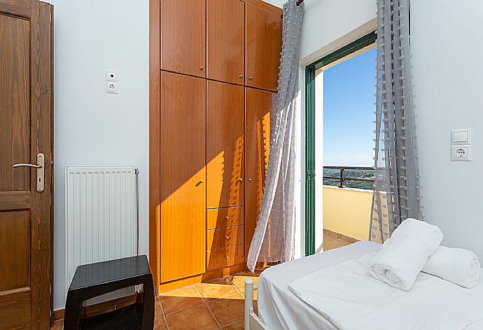 Twin bedroom with A/C and balcony access . - Villa Zeus . (Photo Gallery) }}