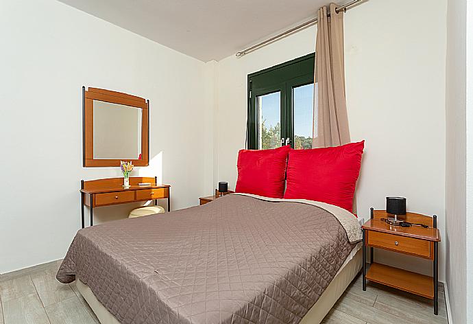 Double bedroom with A/C and balcony access . - Villa Olive . (Photo Gallery) }}