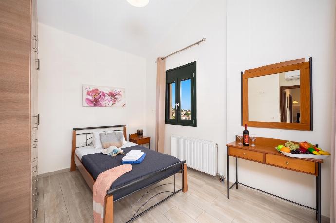 Single bedroom with A/C . - Villa Olive . (Photo Gallery) }}
