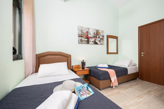 Twin bedroom with A/C . - Villa Olive . (Photo Gallery) }}