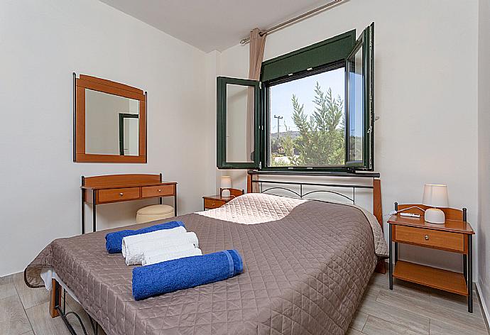 Double bedroom with A/C and balcony access . - Villa Gerani Panorama . (Photo Gallery) }}