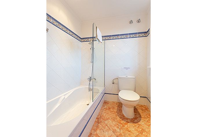 En suite bathroom with bath and shower . - Villa Biniparrell . (Photo Gallery) }}