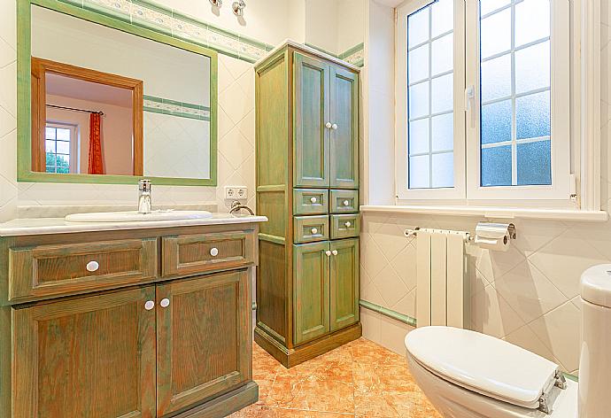 En suite bathroom with bath and shower . - Villa Biniparrell . (Photo Gallery) }}