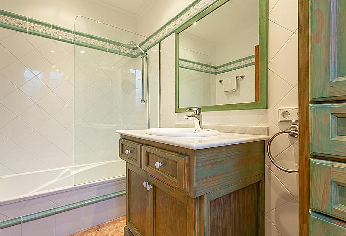 En suite bathroom with bath and shower . - Villa Biniparrell . (Photo Gallery) }}