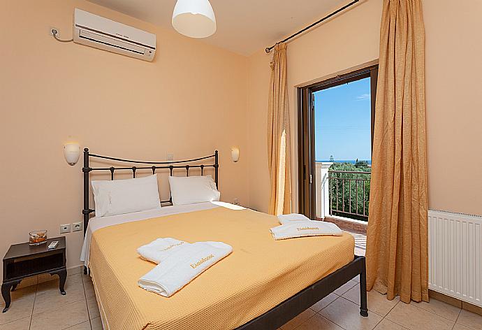 Double bedroom with A/C and balcony access . - Villa Marina . (Photo Gallery) }}