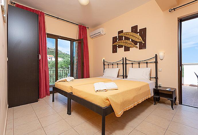 Twin bedroom with A/C and balcony access . - Villa Marina . (Photo Gallery) }}