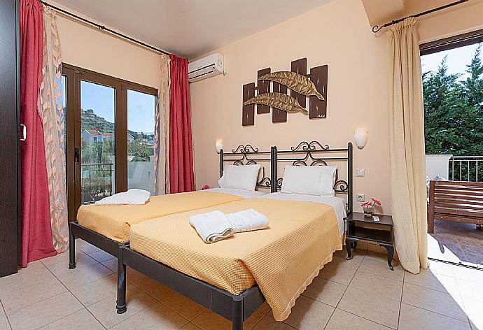 Twin bedroom on first floor with A/C and balcony access . - Villa Eufrosini . (Photo Gallery) }}