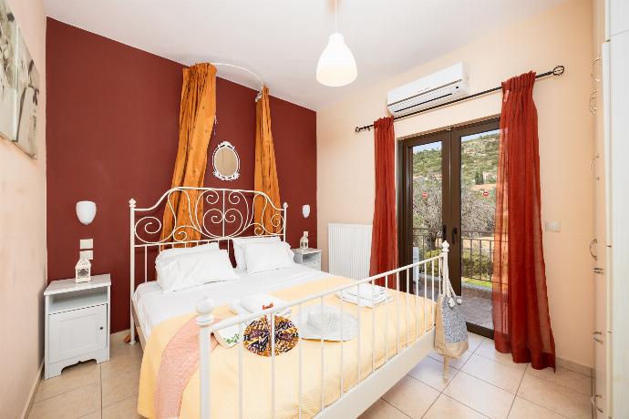 Double bedroom with A/C . - Villa Eufrosini . (Photo Gallery) }}