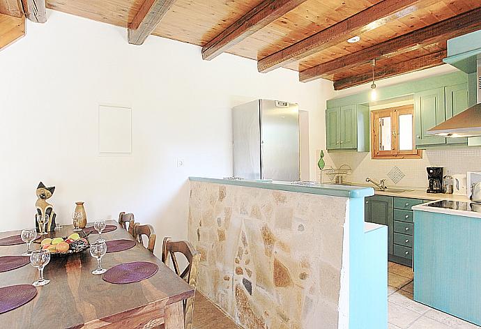 Equipped kitchen and dining area . - Villa Miguela . (Галерея фотографий) }}