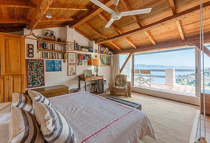 Double bedroom on third floor with A/C, en suite bathroom, and balcony access . - The Olive Press - Agni Bay . (Photo Gallery) }}