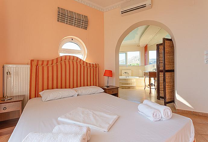 Double bedroom on second floor with en suite bathroom, A/C, and balcony access . - Villa Pelagos . (Photo Gallery) }}