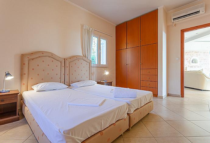 Twin bedroom on first floor with A/C . - Villa Pelagos . (Photo Gallery) }}