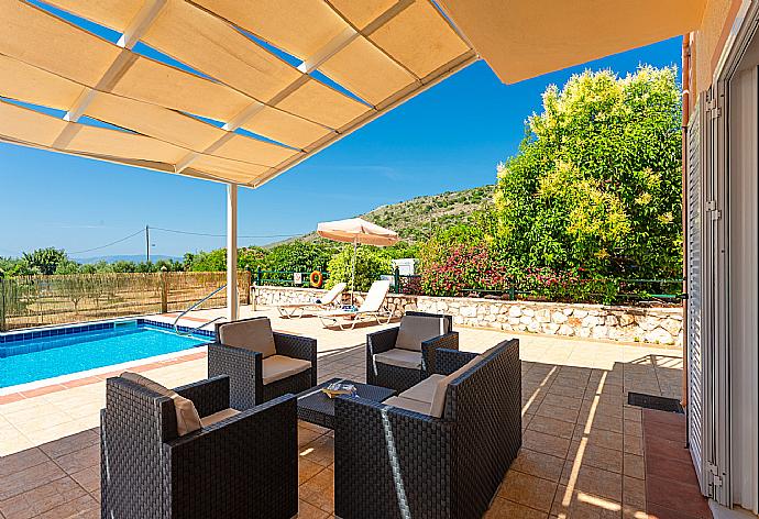 Sheltered terrace area . - Villa Olympia . (Photo Gallery) }}