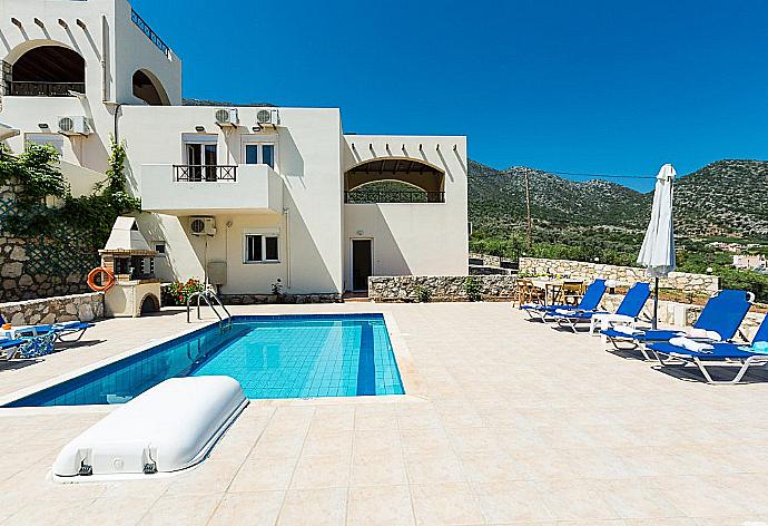 Private pool with terrace and garden area . - Villa Kostis . (Photo Gallery) }}