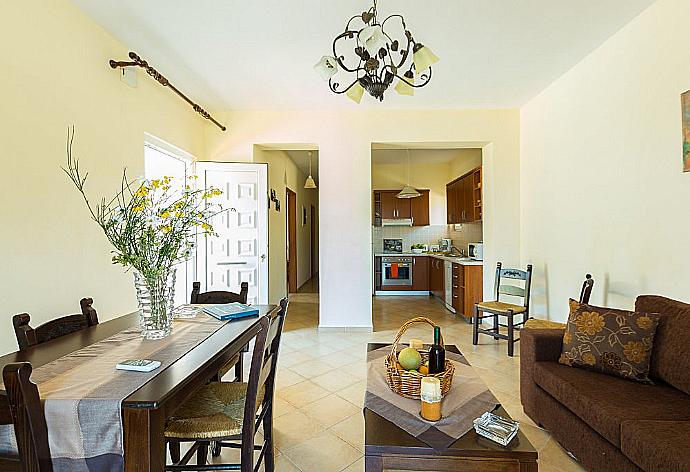 Living and dining area with WiFi, TV, DVD Player and terrace access . - Villa Kostis . (Photo Gallery) }}