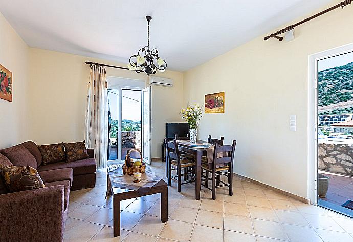 Living and dining area with WiFi, TV, DVD Player and terrace access . - Villa Kostis . (Photo Gallery) }}