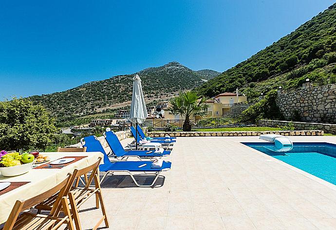Private pool with terrace and garden area . - Villa Kostis . (Photo Gallery) }}