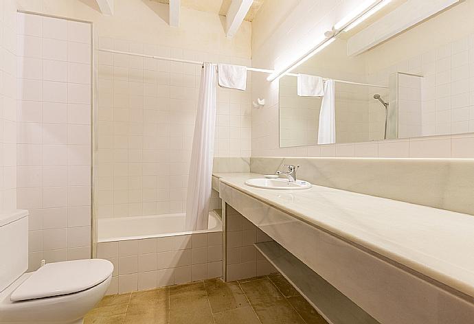 En suite bathroom with bath and overhead shower . - Water Front Villa Shalom . (Photo Gallery) }}