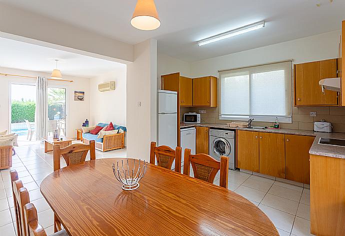 Open-plan living room with sofas, dining area, equipped kitchen, A/C,  WiFi internet, satellite TV, DVD player, and pool terrace access . - Villa Altea . (Galleria fotografica) }}