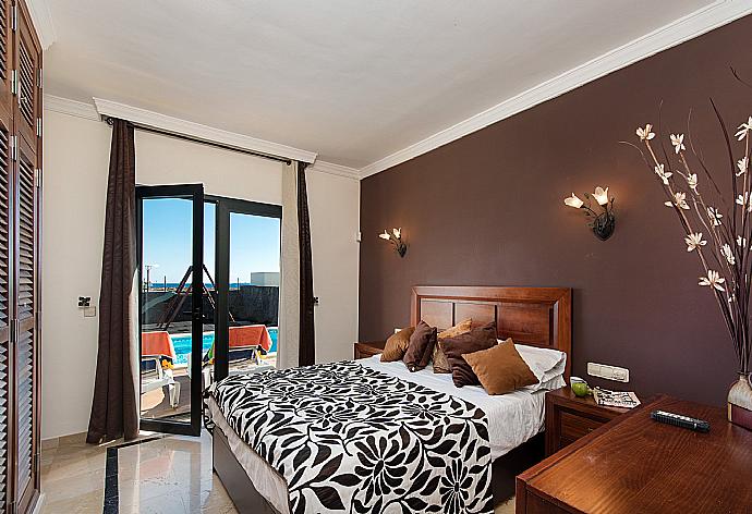 Double bedroom with A/C and terrace access . - Villa Calma . (Photo Gallery) }}