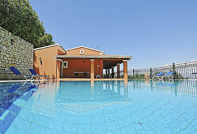 Private swimming pool with sun loungers . - Villa Zeus Kerasia . (Photo Gallery) }}