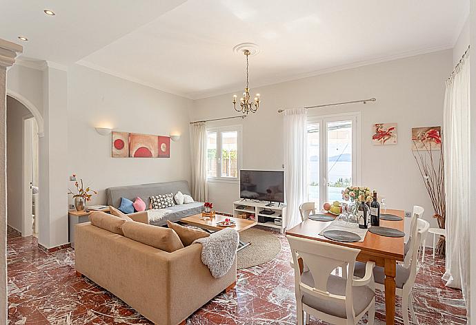 Living room with sofas, dining area, WiFi internet, satellite TV, DVD player, and pool terrace access . - Villa Katerina . (Fotogalerie) }}