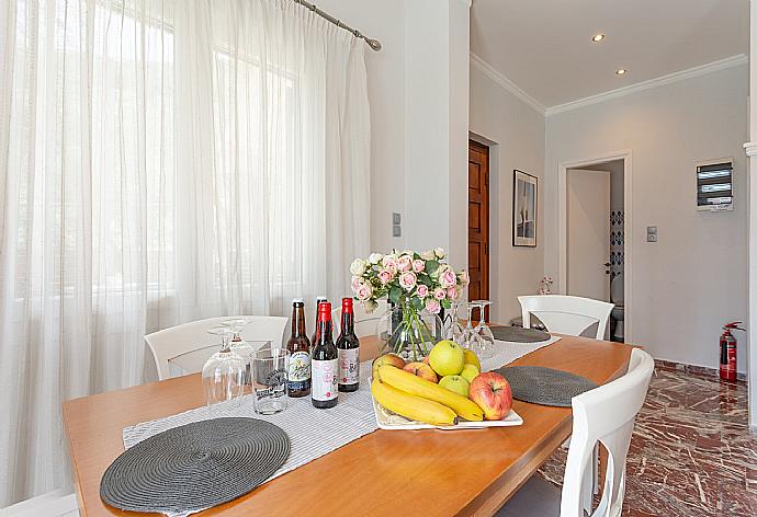 Living room with sofas, dining area, WiFi internet, satellite TV, DVD player, and pool terrace access . - Villa Katerina . (Galleria fotografica) }}