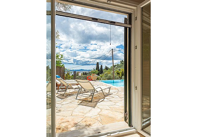 View of pool terrace from bedroom . - Villa Katerina . (Galerie de photos) }}