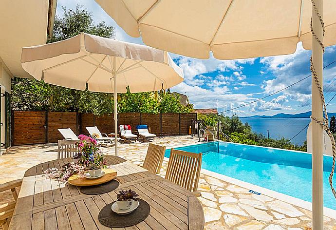 ,Private infinity pool and terrace with sea views . - Villa Katerina . (Photo Gallery) }}