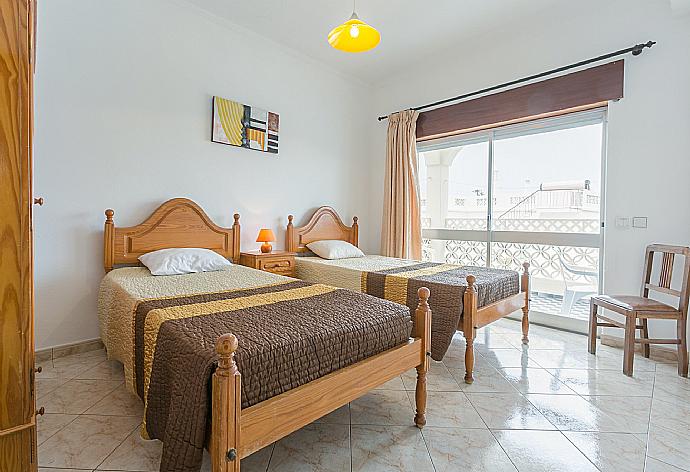 Twin bedroom  . - Beach Villa Barreto . (Photo Gallery) }}
