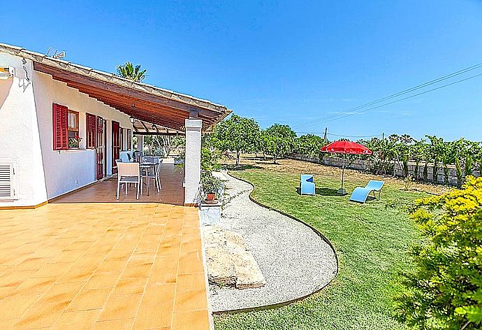 Terrace and garden area . - Villa Dionis . (Photo Gallery) }}