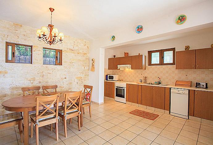 Equipped kitchen and dining area . - Villa Luisa . (Photo Gallery) }}
