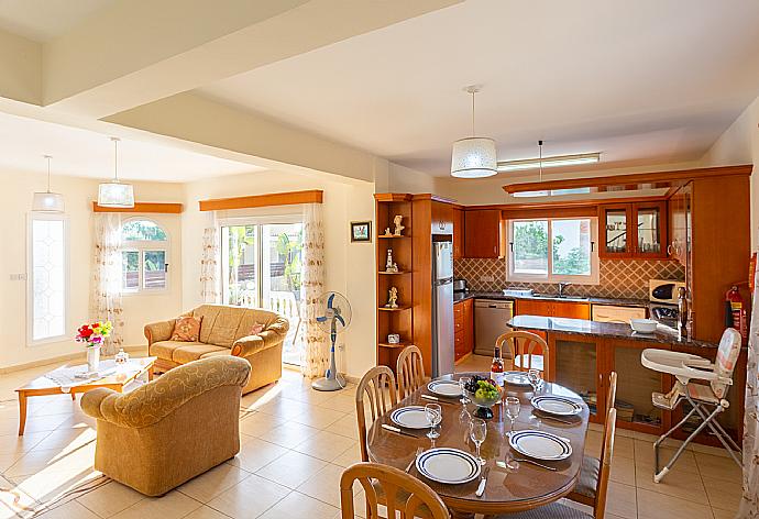 Open-plan living room with sofas, dining area, kitchen, WiFi internet, satellite TV, and terrace access . - Villa Anastasia . (Galerie de photos) }}