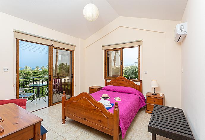 Double bedroom with en suite bathroom, A/C, and balcony access . - Villa Halima Alexandros . (Photo Gallery) }}