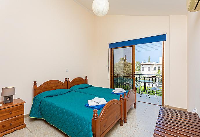 Twin bedroom with A/C and balcony access . - Villa Halima Alexandros . (Fotogalerie) }}