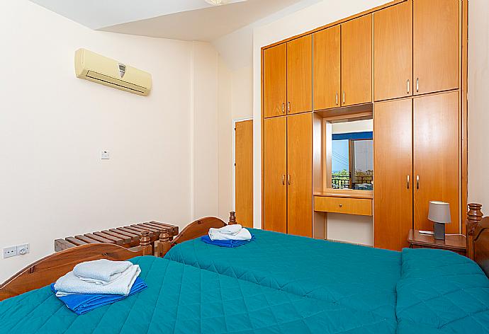 Twin bedroom with A/C and balcony access . - Villa Halima Alexandros . (Photo Gallery) }}