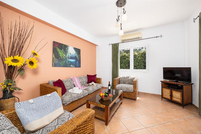 Open-plan living room with sofa, dining area, kitchen, ornamental fireplace, A/C, WiFi internet, and satellite TV . - Villa Thalia Sofia . (Photo Gallery) }}