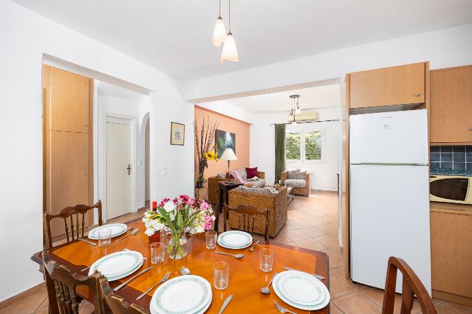 Open-plan living room with sofa, dining area, kitchen, ornamental fireplace, A/C, WiFi internet, and satellite TV . - Villa Thalia Sofia . (Photo Gallery) }}
