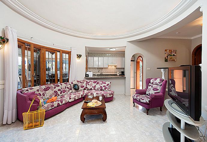 Living room with WiFi, TV, DVD player and terrace access . - Villa Palmira . (Photo Gallery) }}