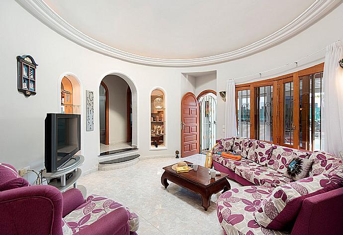 Living room with WiFi, TV, DVD player and terrace access . - Villa Palmira . (Photo Gallery) }}