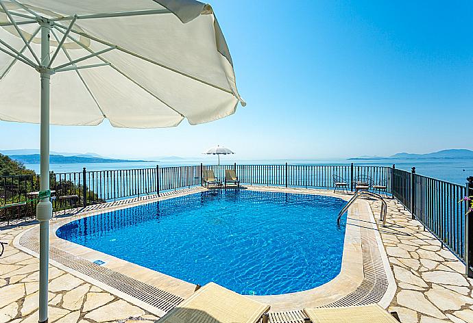 Private pool and terrace with panoramic sea views . - Villa Elpida . (Photo Gallery) }}