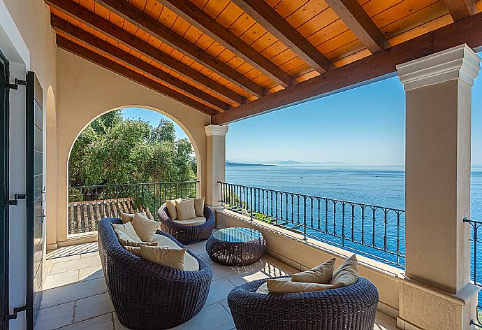 Sheltered terrace area with panoramic sea views . - Villa Elpida . (Photo Gallery) }}