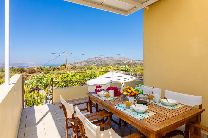 Sheltered terrace area with sea views . - Villa Arda . (Photo Gallery) }}