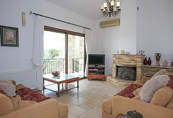 Living room with WiFi, TV, DVD player and terrace access . - Villa Serena Peristeronas . (Photo Gallery) }}